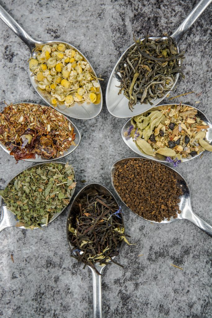 An image of herbs on spoons